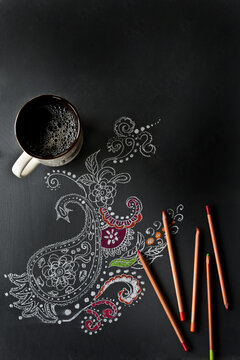 Artist work on table with colored pencils 
