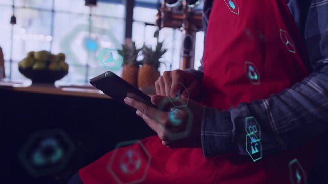Barista in red apron tapping phone, teal hex icons appearing and floating, visualizing order flow