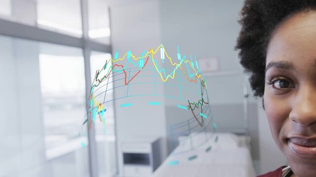 Clinician observing holographic sphere with line graphs materializing before her for patient care