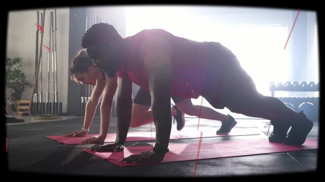 Holding plank, partners starting mountain-climber drill with red overlays for fitness, easing kneel
