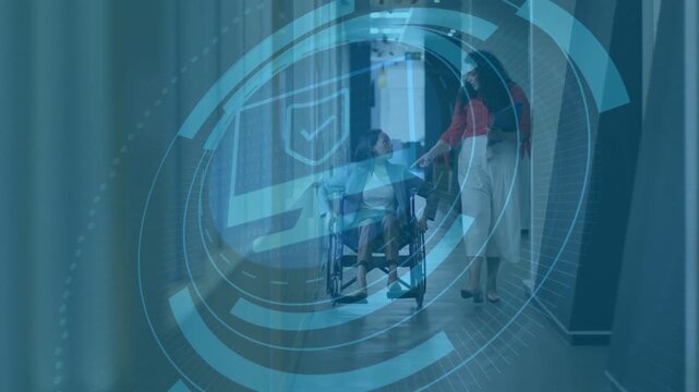 Caregiver tapping phone and sharing health info overlay while assisting wheelchair user down ward