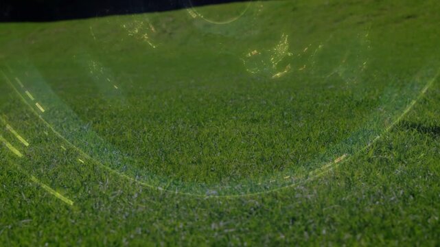 Athlete sliding into kneeling, bracing sports turf after foot entering frame, bubble arc overlaying