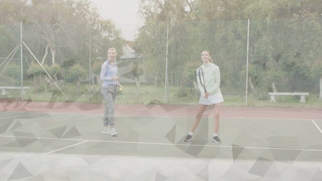 Left feeder tossing balls and right player practicing forehand backhand strokes in tennis training