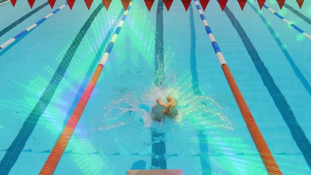 Male swimmer pushing off starting block, diving into lane, creating splash and bubbles in swim meet