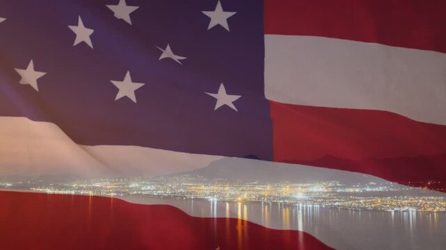 Translucent US flag for broadcast overlaying skyline, rippling right from wind and revealing lights