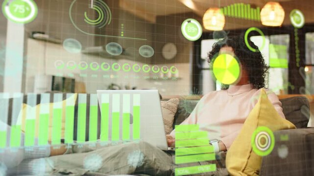 Non-binary adult lowering mug and typing on laptop shifting posture while monitoring data charts