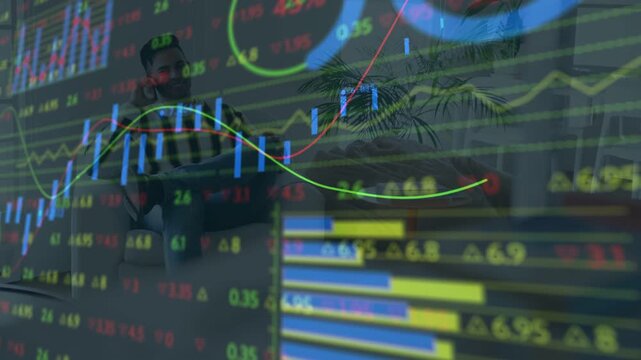 Male analyst on couch tapping tablet, causing candlesticks and tickers shifting, analyzing markets