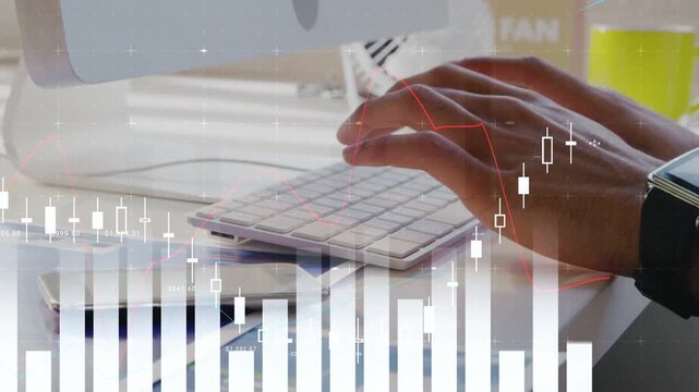 Right hand approaching keyboard while hands typing at desk, updating animated finance charts upward