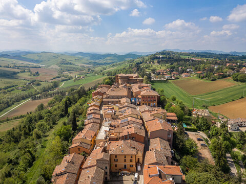 Italy, 10 April 2026: Aerial drone view of Dozza medieval village in Emilia Romagna, featuring the historic Rocca Sforzesca fortress, colorful murals, tiled rooftops, and scenic Italian countryside la