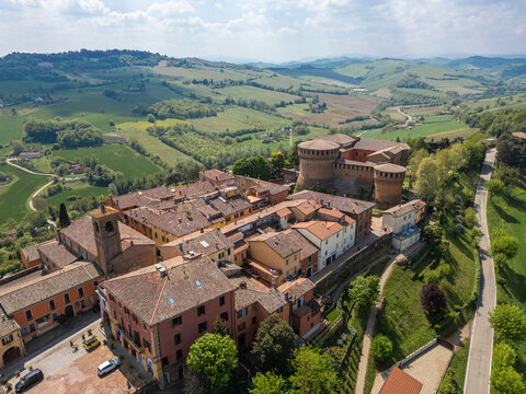 Italy, 10 April 2026: Aerial drone view of Dozza medieval village in Emilia Romagna, featuring the historic Rocca Sforzesca fortress, colorful murals, tiled rooftops, and scenic Italian countryside la
