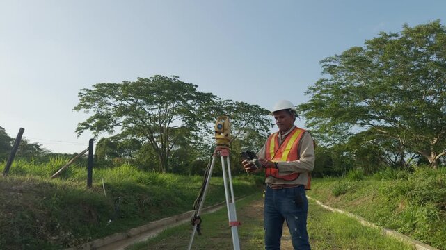 Surveyor engineering at a construction site using total station