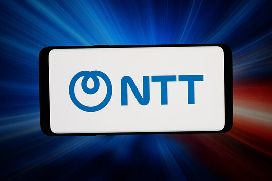 Stuttgart, Germany - 04-10-2026: In this photo illustration, the logo of Japanese telecommunications company NTT Inc. is displayed on a smartphone in front of abstract background on computer screen.