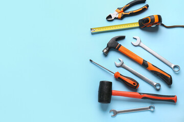 Obraz premium Different construction tools on blue background