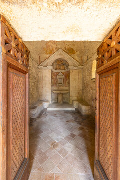 Tempietto del Clitunno interior with open carved doors