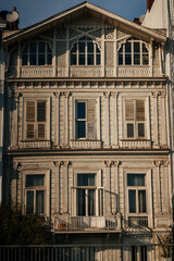 Elegant Wooden Facade Illuminated With Gentle Sunset Glow Highlighting Intricate Decorative Elements © Yashkin Ilya