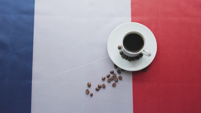 Close-up of a cup of coffee on France flag