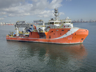 Fototapeta premium Multi Purpose Offshore supply Vessel left the port. specific equipment for assist to gas and oil drilling platforms on board