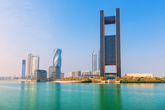 2 December 2025, Bahrain, Manama: cityscape with contemporary architecture along the clear blue water, representing Middle Eastern travel