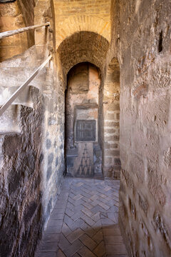 Ancient stone passage with arched alcove in Baeza, Andalucia