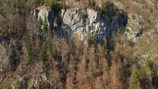 Aerial view of alpine limestone cliff in golden sunset light, Ebensee, Austria