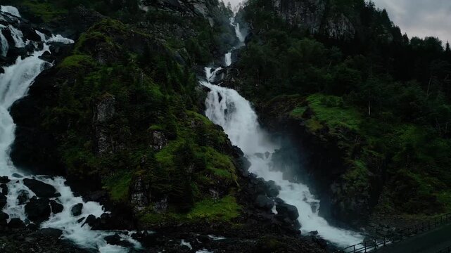 L&aring;tefossen waterfall in rainy evening in Norway