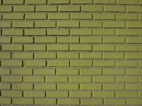 Green Brick Wall with Purple Accent Background