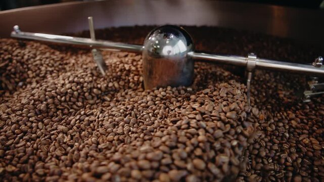 Top view roasted coffee beans in cooling drum.