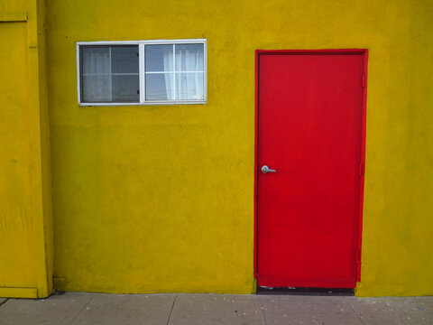 Bright Yellow Wall with Bright Red Door and Window