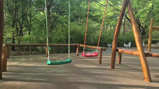 8K UHD Empty Swing Swaying Gently in Sunny Children's Playground
