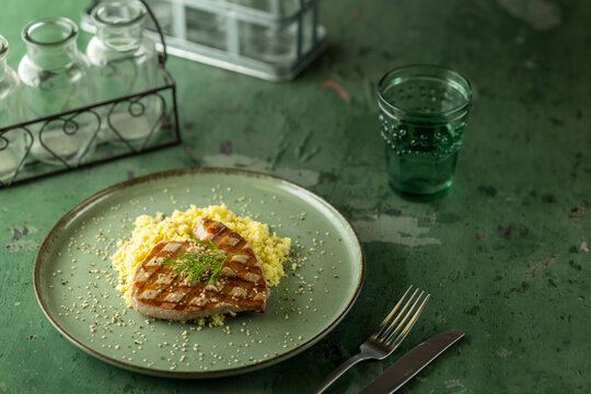 Grilled tuna steak with couscous and dill creating healthy meal