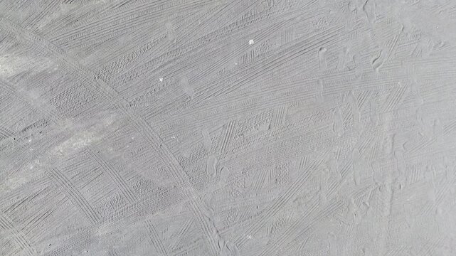 drone landing material texture abstract sand plan rough grey tire track dirt road pattern flying - Andalusia, Spain - 2025