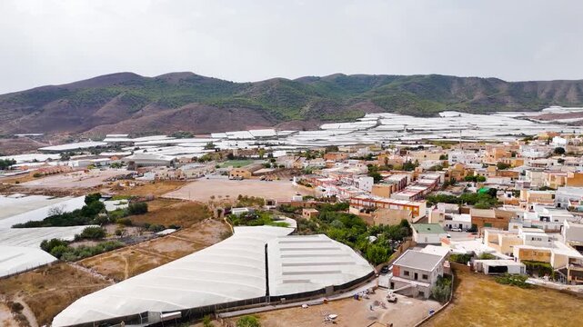 urban old town rural city mountain landscape drone aerial travel vacation forest horizon building agriculture field greenhouse invernaderos plastic sea - Dal&iacute;as, Andalusia, Spain - 2025