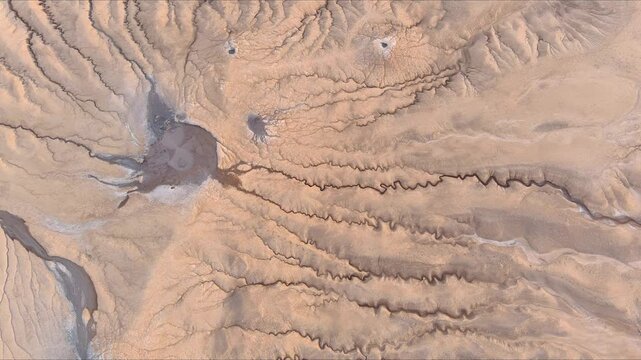 Aerial view of Vulcanii Noroiosi Paclele Mici mud volcanoes with unique geological formations and eroded terrain Scortoasa, Buzau County, Romania.