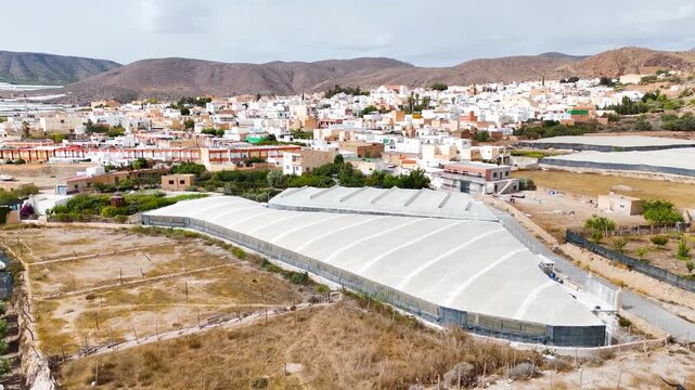 greenhouse town agriculture city invernaderos urban travel mountain horizon field modern intensive farming plastic sea drone aerial - Dal&iacute;as, Andalusia, Spain - 2025