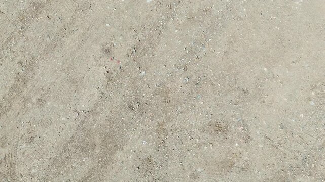 rough texture landing drone travel motion sand ground earth detail grunge aerial plan down downfall abstract grey - Andalusia, Spain - 2025