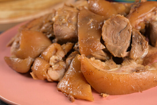 Close-up macro shot of juicy pork carnitas and cueritos Michoacan style