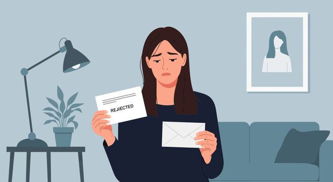 Woman feels disappointed after receiving rejection letter while sitting in her living room during the evening