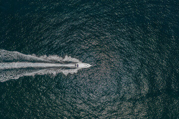 Naklejka premium Yacht boat tour. Luxury boat yachting. Motorboat sailing at sea. Luxury private yacht in sea. Motor yacht luxury vessel. Boat motor aerial. Vacation on summer. Aerial view motorboat