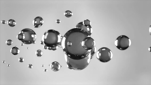 A high-quality 3D render of glossy, reflective metallic spheres of various sizes floating in mid-air. The background is a clean, bright minimalist white, which emphasizes the sharp reflections and chr