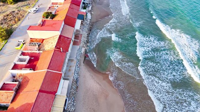 beach house coast drone roof aerial wave water building architecture sea border coastline residential - Guardamar del Segura, Alicante, Spain - 2025