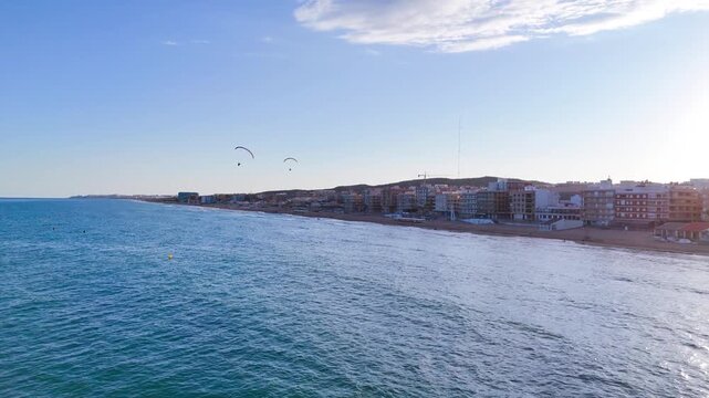 cityscape sea coastline summer coast urban beach sunset evening drone aerial flying travel - Guardamar del Segura, Alicante, Spain - 2025
