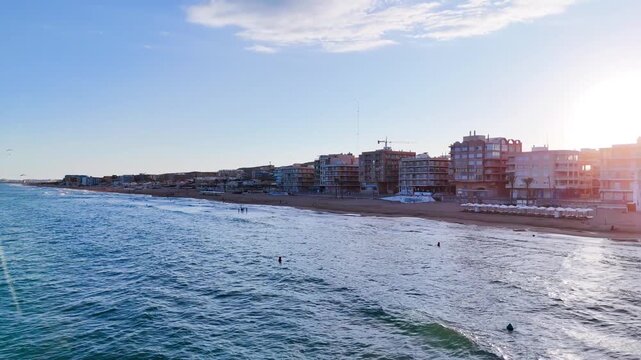 beach city drone travel aerial building facade coastline sea coast summer blue sky flying chiaroscuro water urban - Guardamar del Segura, Alicante, Spain - 2025