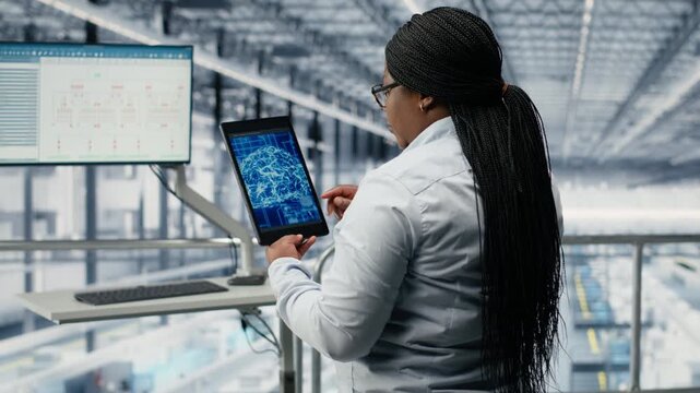 Using AI model, innovative technology roadmap and businesswoman in microchip factory. Developing high tech semiconductors, deep learning and African american female manager