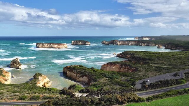 Bay of Islands Coastal Park, Peterborough, Victoria, Australia: 4K aerial drone footage of limestone cliffs, ocean waves, rock stacks and Great Ocean Road coastline.