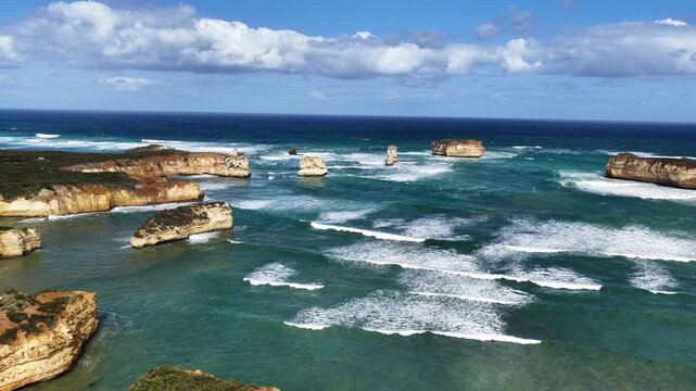 Bay of Islands Coastal Park, Peterborough, Victoria, Australia: 4K aerial drone footage of limestone cliffs, ocean waves, rock stacks and Great Ocean Road coastline.