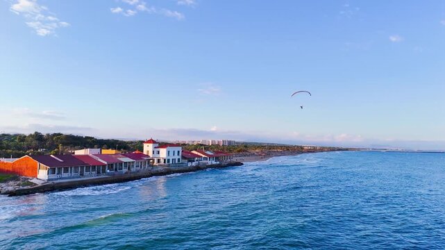 paragliding travel vacation summer coastline beach residential coast house architecture drone sky flying sunlight sunset fun view urban nature sea water - Guardamar del Segura, Alicante, Spain - 2025