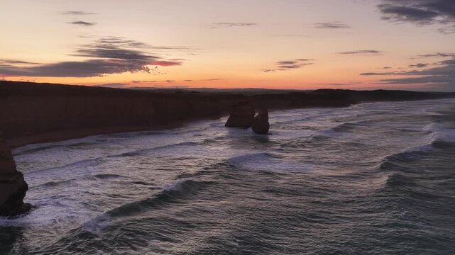 Gibson Steps and Port Campbell National Park, Great Ocean Road, Victoria, Australia at sunrise: 4K aerial drone footage of cliffs, beach, ocean waves and coastal landscape near Twelve Apostles.