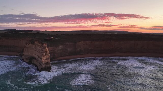 Gibson Steps and Port Campbell National Park, Great Ocean Road, Victoria, Australia at sunrise: 4K aerial drone footage of cliffs, beach, ocean waves and coastal landscape near Twelve Apostles.