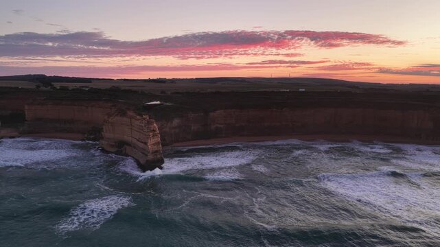 Gibson Steps and Port Campbell National Park, Great Ocean Road, Victoria, Australia at sunrise: 4K aerial drone footage of cliffs, beach, ocean waves and coastal landscape near Twelve Apostles.