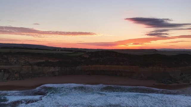 Gibson Steps and Port Campbell National Park, Great Ocean Road, Victoria, Australia at sunrise: 4K aerial drone footage of cliffs, beach, ocean waves and coastal landscape near Twelve Apostles.